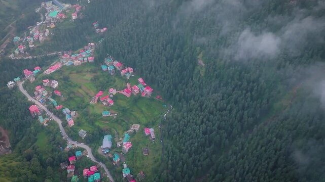 Drone view of winding roads and peaceful hillside settlements in the scenic Mashobra Valley.