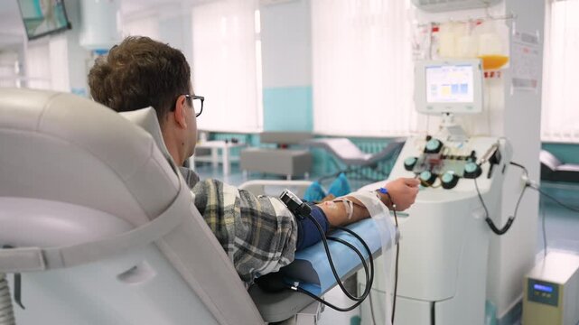 Male patient donating rare blood in a hospital clinic