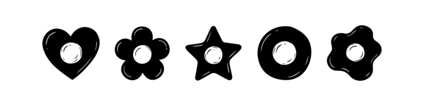 A set of five playful black fried egg icons in various shapes including heart, flower, star, and circle. Minimalist vector silhouettes for modern breakfast or food-themed graphic designs.