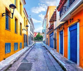 Photo of the colorful narrow alleyway of Areos street in the historic Plaka neighborhood of Athens, Greece. © Antonios