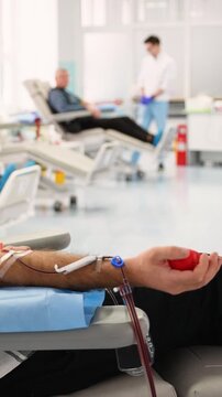 Male patient donating blood in a modern hospital center