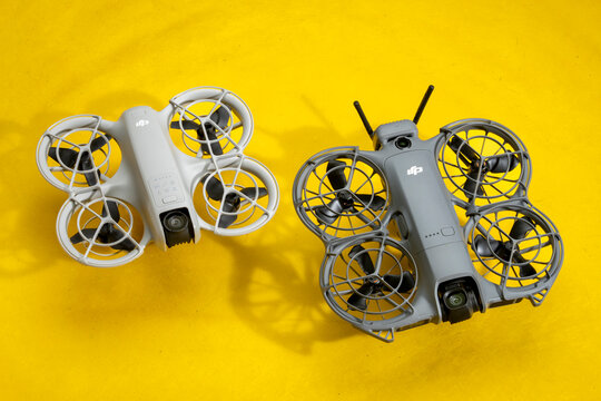Fort Collins, CO, USA - April 8, 2026: DJI Neo 2 mini drone and its original model on art paper. It offers a creative and fun alternative to a selfie stick or tripod.