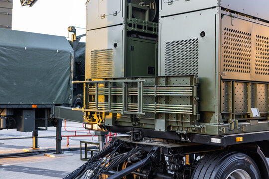 Military equipment and army equipment.. Robust military trailer built for field communication and mobility services. Heavyduty military transport equipped with racks and cables