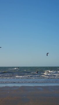 Kitesurfers riding the waves in northeastern Brazil
