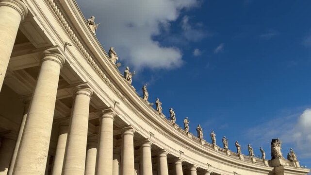 Rome, Italy Panoramic view of St. Peters Square in Vatican City. Majestic colonnades, classical statues, and open sky create a historic and iconic scene.