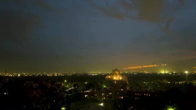 Ambedkar Park landscape in Noida beside Yamuna River. Sunset after rainfall with clear sky, reflecting serene water, greenery. Delhi urban skyline architecture. Travel, tourism and peaceful lighting