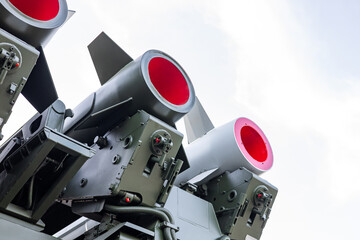 Military equipment and army equipment.. Detailed view showcasing security features of missile assembly components. Focusing on essential safety measures embedded within missile nozzle © NastyaPhoto