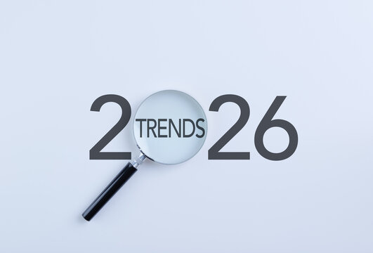 2026 Business Trends and Future Forecast Concept. Magnifying glass highlighting 2026 trends representing market outlook, strategic planning, innovation tracking, future business insights, finance