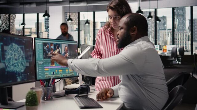 Videographers team using AI software tools for video editing on PC, working in studio office with neural networks system. Timeline development with cinematic transitions and montage clips.