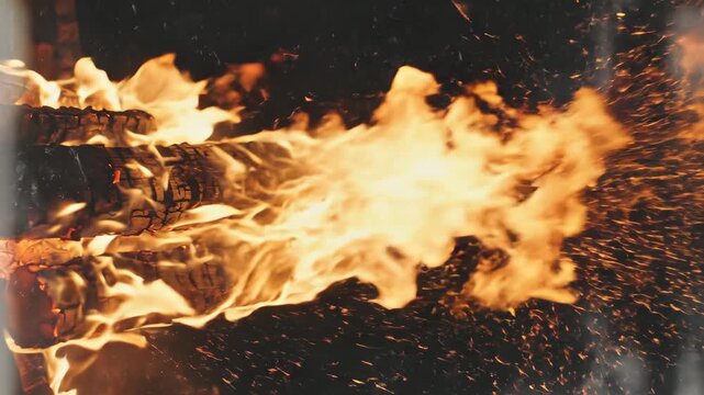 Abstract fiery explosion with glowing embers and light streaks against a dark background