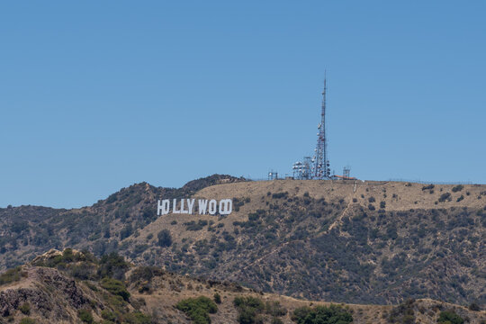 Los Angeles, California, USA - July 6, 2022: The iconic Hollywood Sign on Mount Lee within Griffith Park overlooking the Hollywood district in Los Angeles, California. 