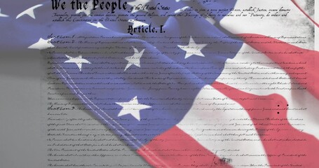 Fototapeta premium Displaying folded US flag overlaid on parchment showing Constitution text in studio, with ink marks