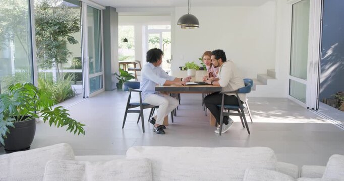 Couple and African American man opening folder, leaning at dining table, reviewing papers with pen