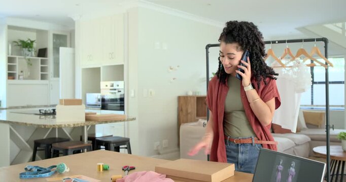 Adult woman on phone call, opening boxes, handling laptop and packing dresses for online orders