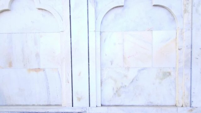Intricate marble wall carvings and jali work at Taj Mahal, Mughal architecture with geometric patterns, arches, heritage monument showcasing Islamic art, craftsmanship and cultural tourism Agra India