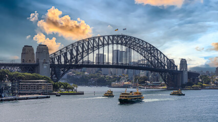 Obraz premium 10 April 2026 view of Sydney Harbour and Circular Quay on a Beautiful Autumn Afternoon lovely colours of the sky in Sydney NSW Australia
