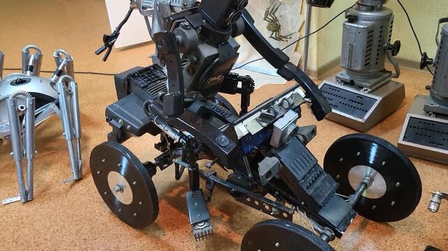 Hexapod robot walking on a table in a lab, high tech robotic engineering and AI development