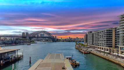 Obraz premium Title: View of Sydney Harbour and Circular Quay and Sydney Harbour Bridge in on beautiful Autumn Afternoon beautiful Sky Sydney NSW Australia