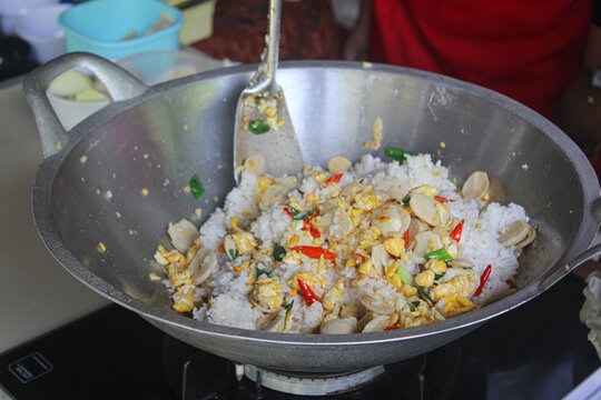 Indonesian Street Food Spicy Fried Rice with Meatballs and Scrambled Egg in Wok
