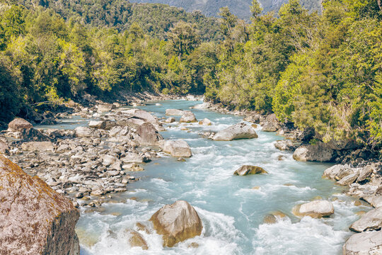 Hornopir&eacute;n, Chile - March 20, 2026: The Blanco River, with its turquoise waters, flows through the lush nature of Chilean Patagonia. The majestic Cerro Cholila can be seen in the mountains.