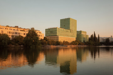 Fototapeta premium man opens wooden gate to lush green field symbolizing beginning of new day