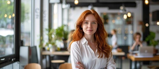 Elegant Portrait: A striking redhead woman with captivating eyes radiates confidence in a stylish, well-lit cafe setting, the image captures a sense of poise and allure. 