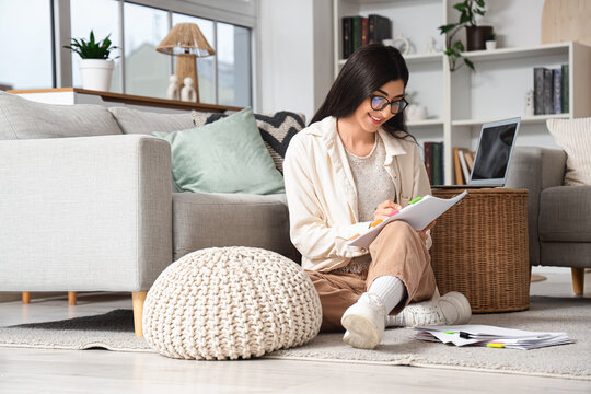 Female screenwriter writing script in office