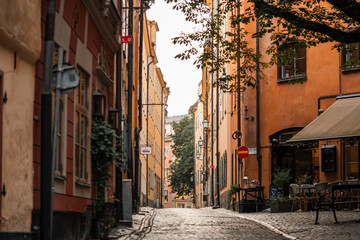 Obraz premium Gamla Stan old city in Stockholm, Sweden. Historic yellow and orange homes with narrow alleys.