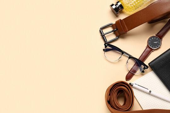 Different male accessories on beige background
