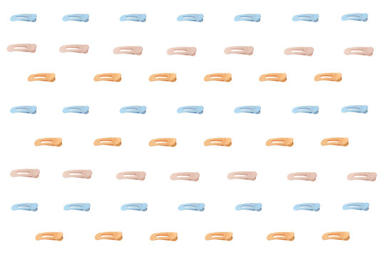 Soft pastel hair clips arranged neatly in rows. Each clip has a gentle, minimalist design. Neutral tones include peach, blue, and pink. For fashion, beauty,  lifestyle editorial use, seamless pattern