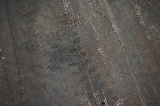 Imagen horizontal de un suelo de cemento con textura vieja y desgastada