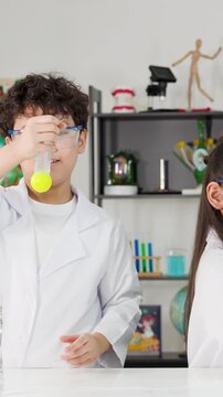 Asian Students Conduct Bernoulli Principle Science Experiment with Ping Pong Balls