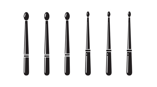 Drumsticks arranged in a row showing varied sizes and tip shapes on a white background