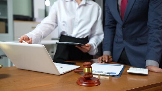 Lawyers and business professionals discuss contract papers at the office. legal and corporate consultation concept focusing on law, advice, and business agreements.