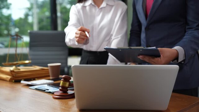 Teamwork of business lawyer meeting working hard about legal legislation in courtroom to help their customer