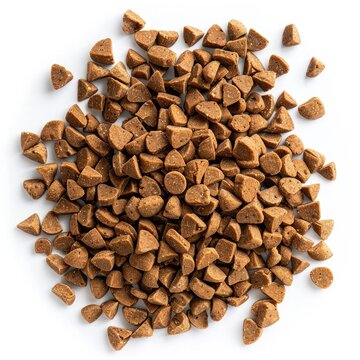 Overhead view of a pile of small, brown, triangular-shaped dog food kibble on a white background.