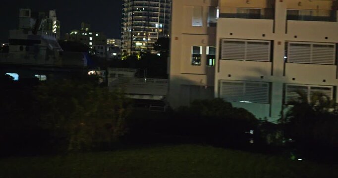 Vew from inside the car, a view of Japanese city at night