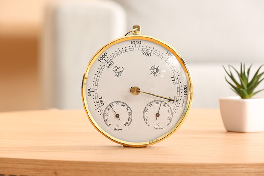 Aneroid barometer on table in room, closeup