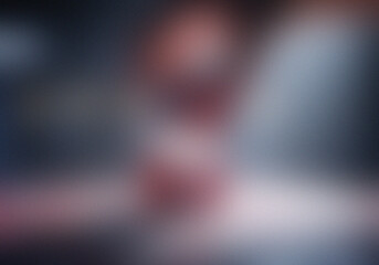 Obraz premium Blurred abstract gradient with soft pink and grey hues