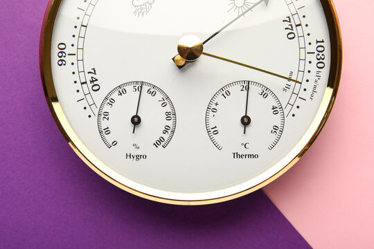Aneroid barometer on colorful background