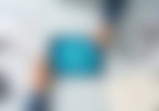 Abstract blur of light blue and soft pastel shades on textured surface