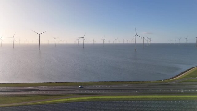 Static sunrise view across dam from the IJsselmeer side