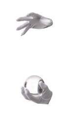 Male magician's hands with crystal ball on white background