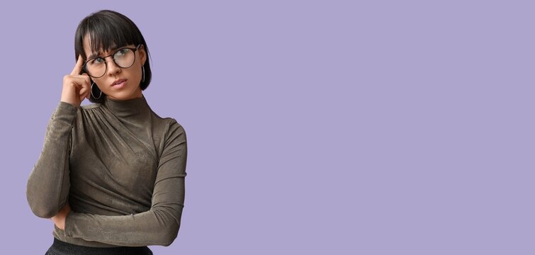 Portrait of pensive young woman trying to remember something on lilac background with space for text