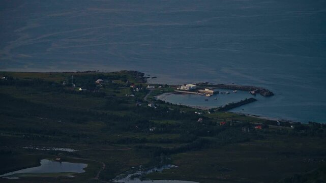 Middagsfjellet, Sandland, Nordkapp, Finnmark, Norway - A Peaceful Coastal Village With a Harbor, Surrounded by Lush Green Land and the Vast Ocean Beyond - Static Shot