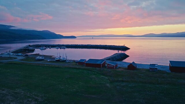 Kokelv, Hammerfest, Finnmark, Norway - The Serene Harbor Glows at Sunset, With Boats Docked and Red Houses Along the Shore - Wide Shot
