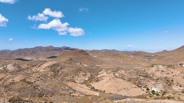 Flight cruises over the dramatic ancient volcanic landscape of Cabo de Gata Nijar National Park, and luxury Spanish farm houses Almeria
