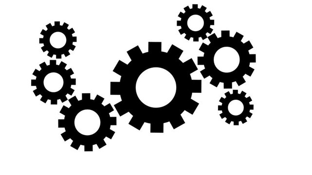 Arrangement of black gears on a white background showcasing mechanical parts