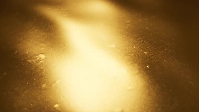 High resolution gold colored background with a soft gradient transition from light yellow to deep amber, featuring a smooth texture and a subtle metallic sheen for backdrop use.