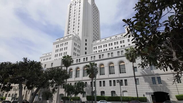 Gimbal wide booming up shot of the Art Deco-style City Hall in downtown Los Angeles, California. 4K